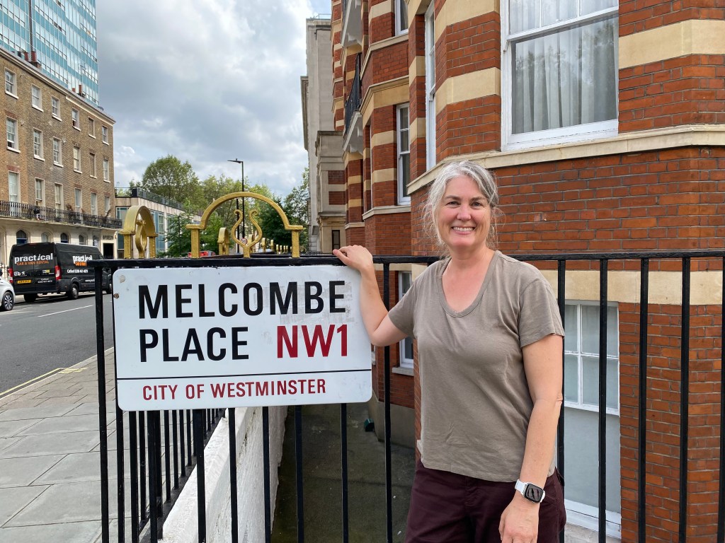 Chalon standing in front of a street sign, Melcombe Place NW1, City of Westminster.
